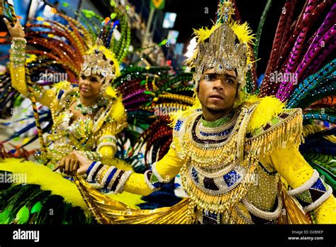 grande rio samba school flag berrer and escort  carnival - brazil - sambaschool stock pictures, royalty-free photos & images